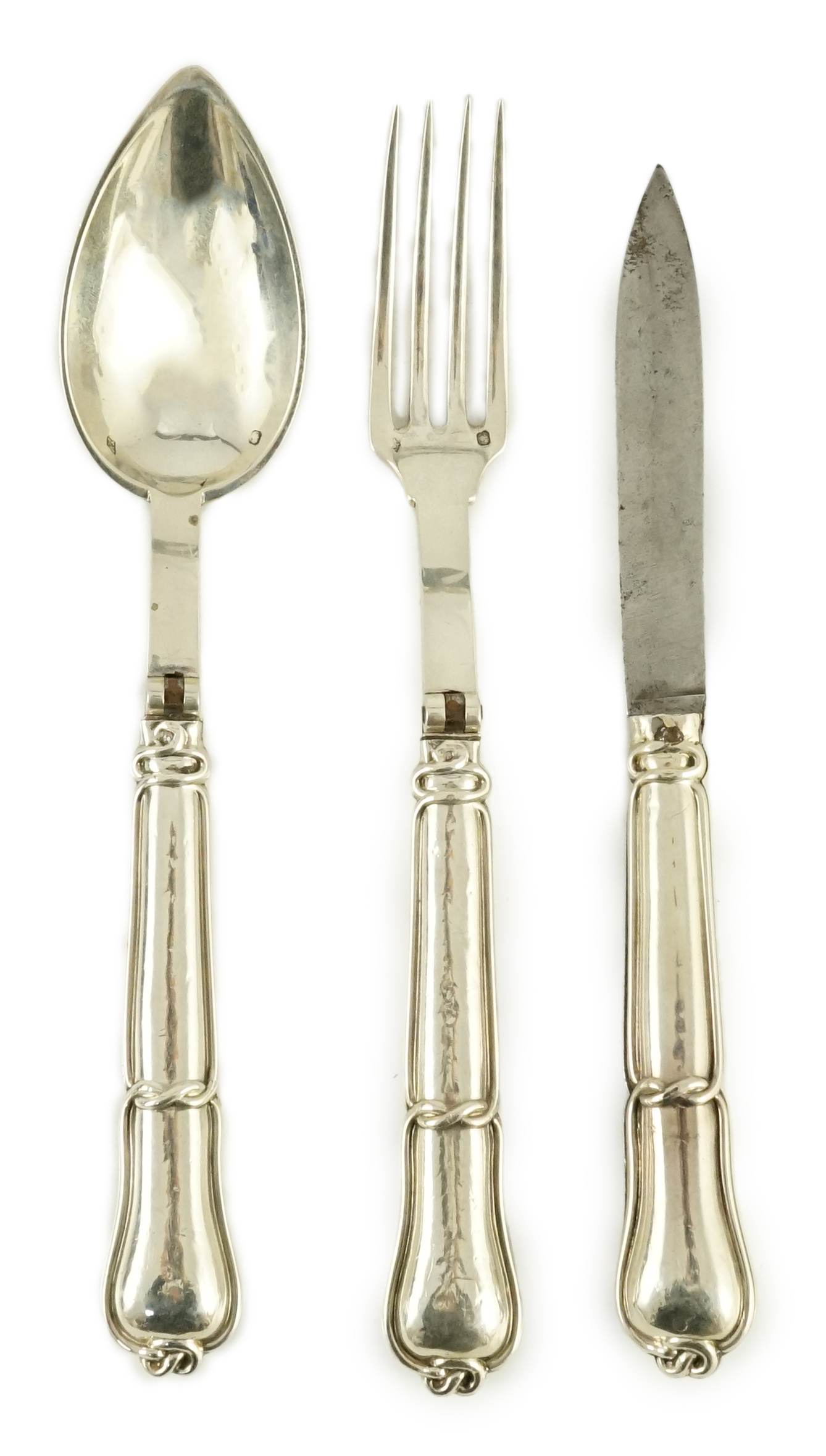 A 19th century French part silver campaign set, comprising a folding knife, fork and spoon, marks for Hippolyte Thomas, circa 1845-1855
